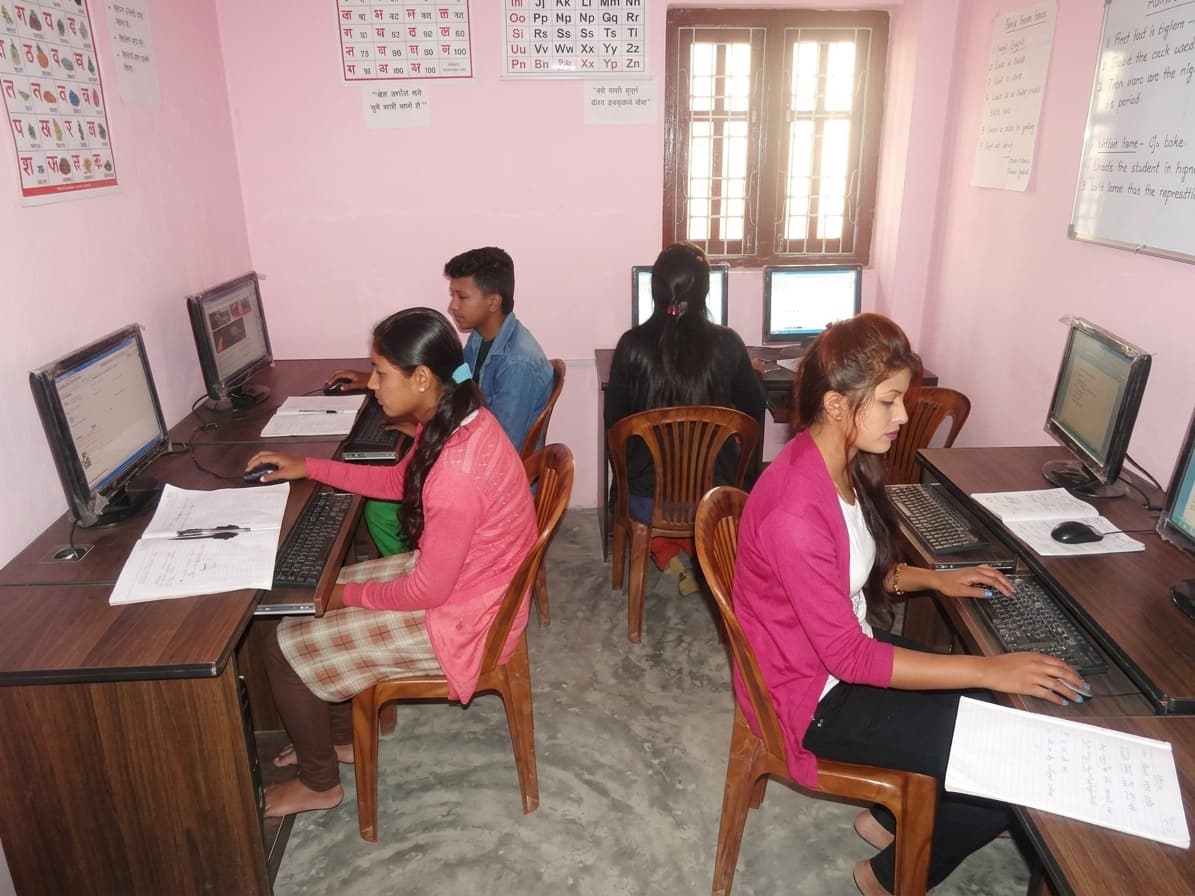 Student practicing computer skills on a laptop